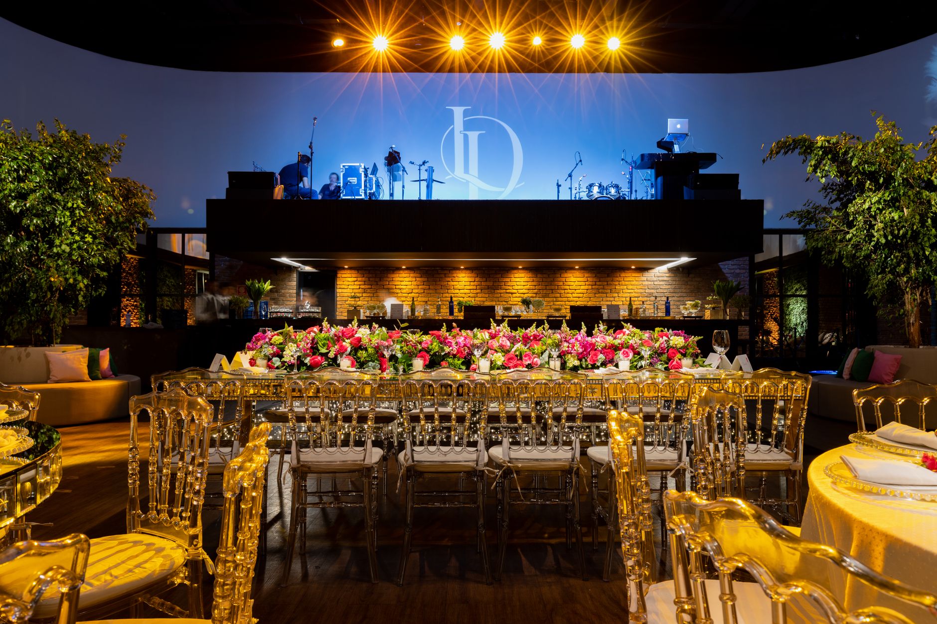 Beautiful wedding venue with luxurious floral table setting and illuminated stage. — Dado Rail Designs for Seamless Wall Deco